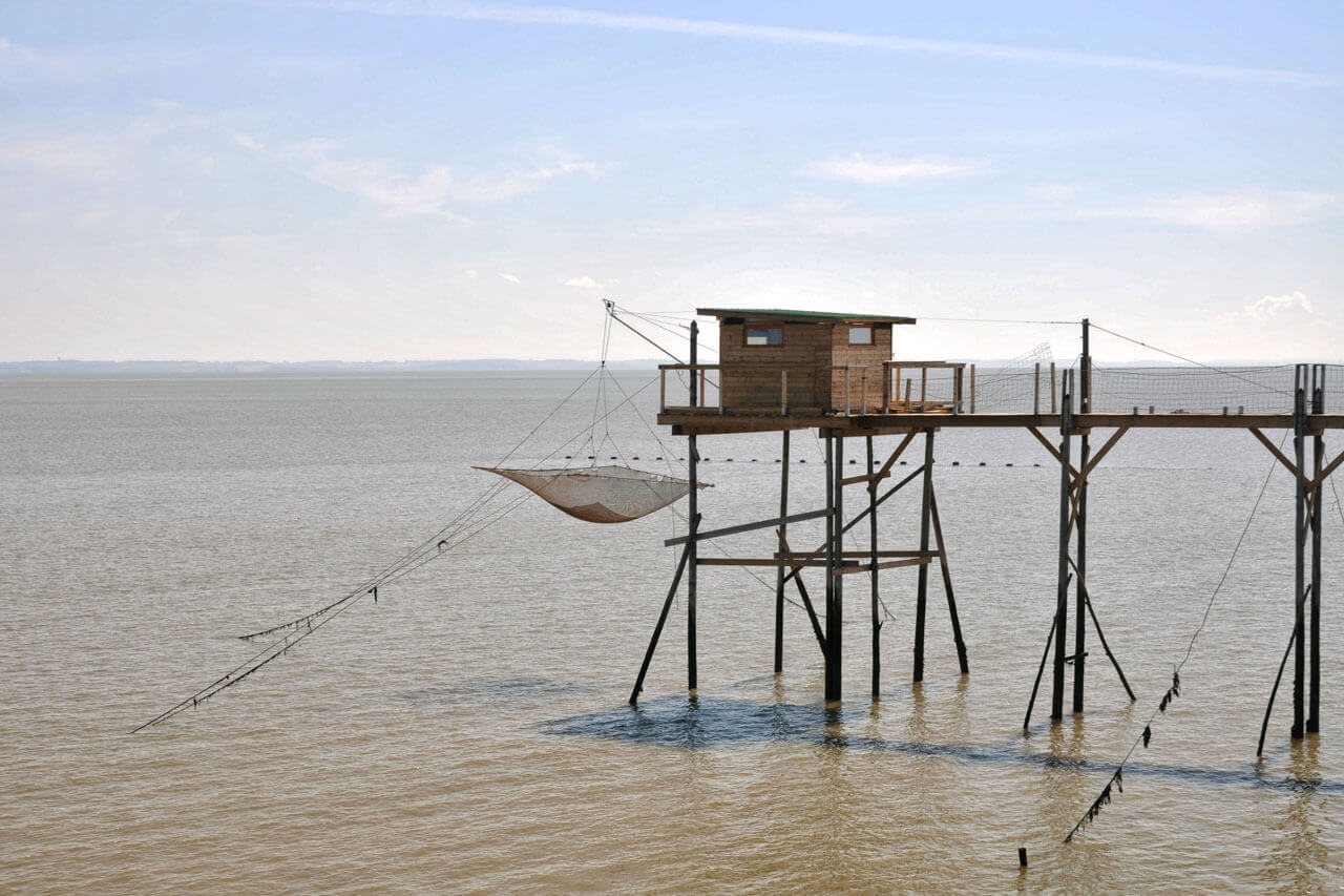 Fischerhaus auf Stelzen über dem Meer Sprachkurs mit Kulturbezug